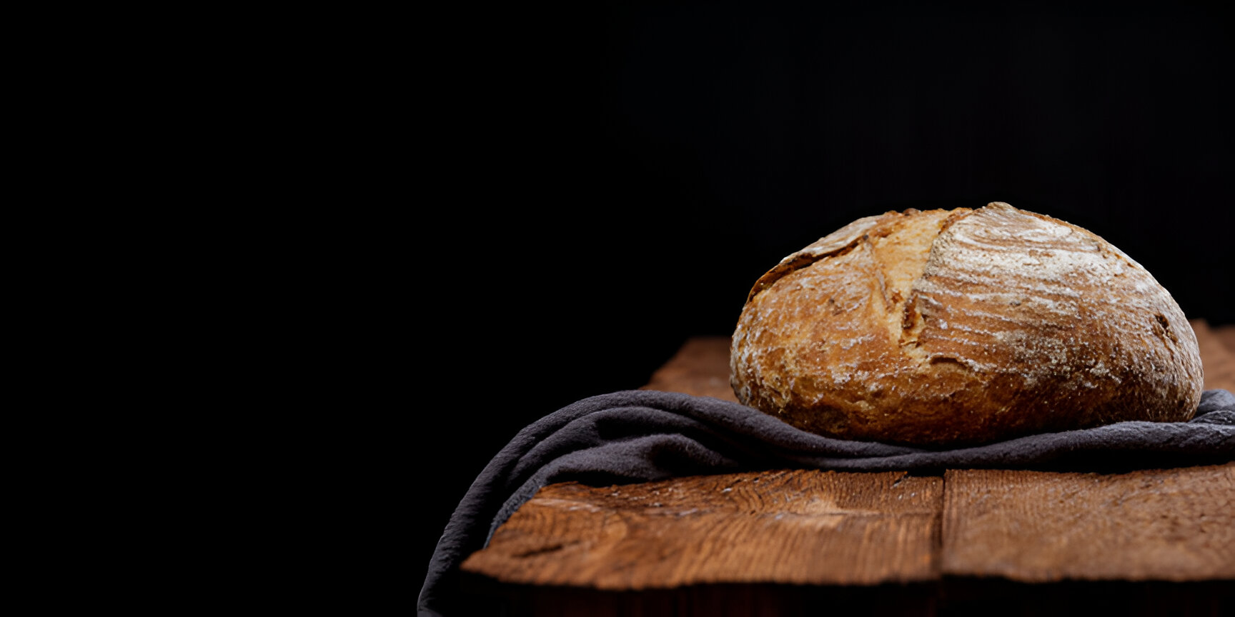 Artisanal bread on a dark rustic background
